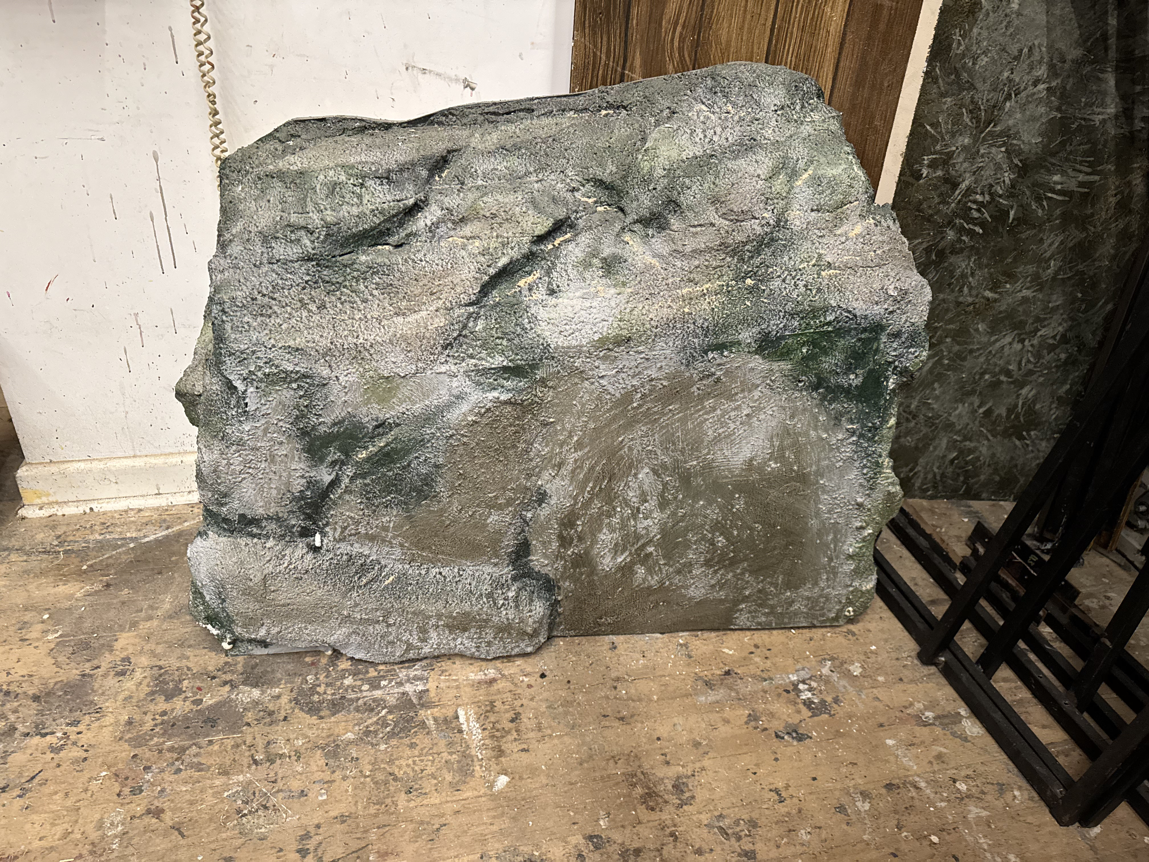 Woman in knee-length print dress walking down runway