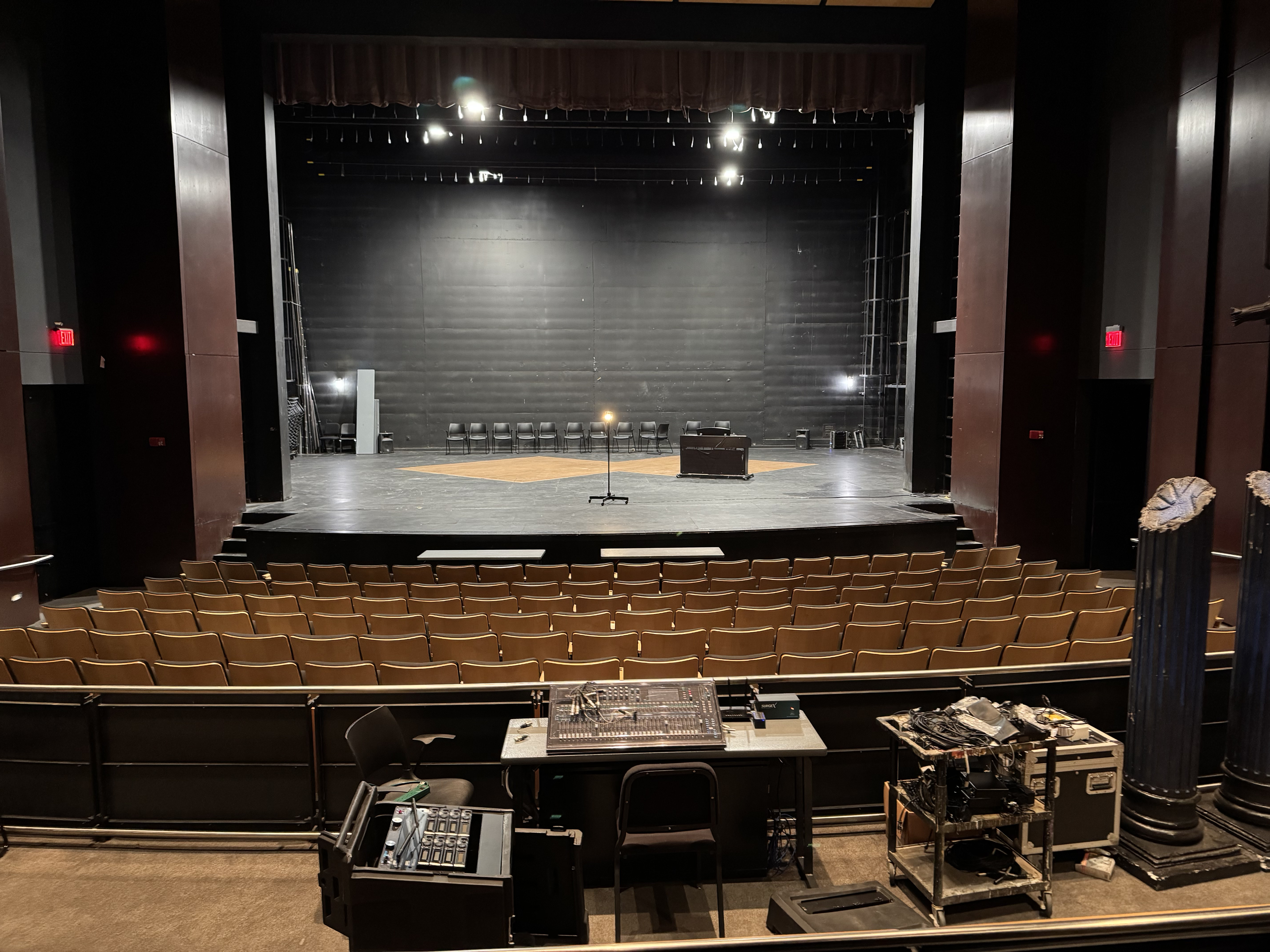 Woman with sunglasses walking down runway