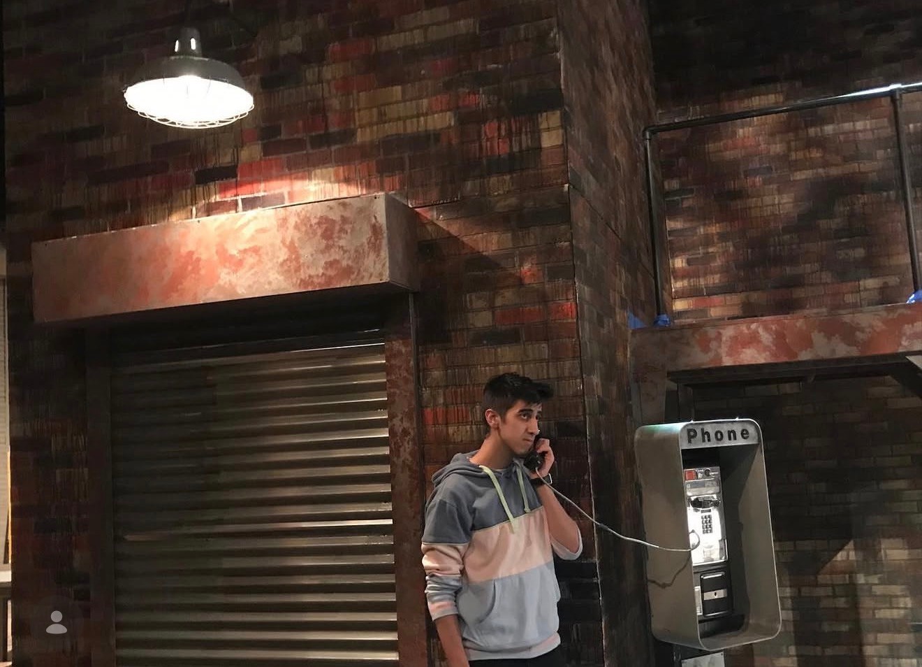 Woman in white dress and gold earrings walking down runway
